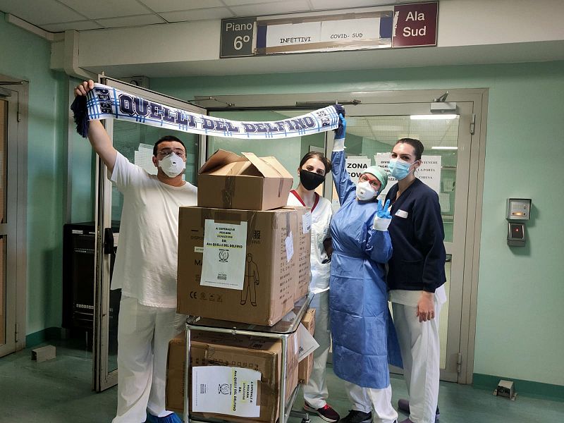 Il club Quelli Del Delfino consegna le tute anti Covid, foto 1